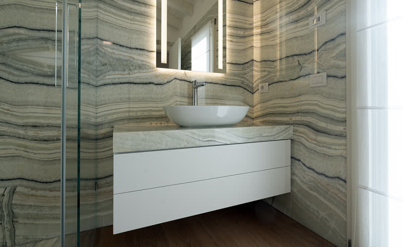 Chiffon onyx bathroom with washbasin and backlit mirror
